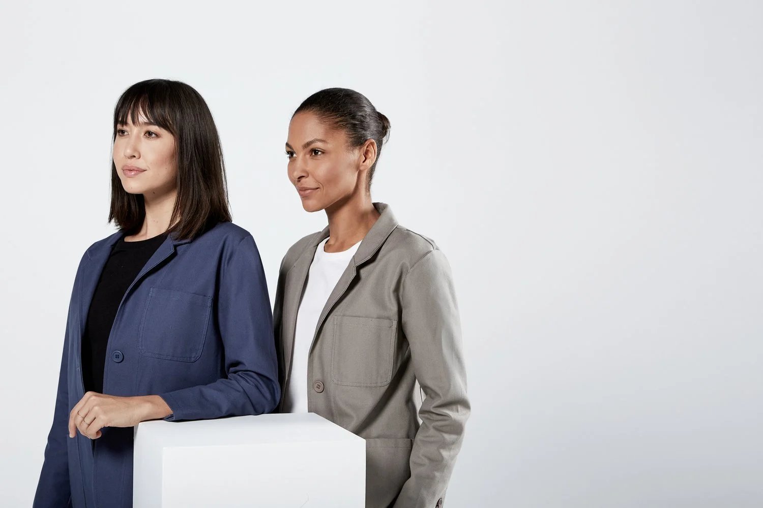 Two women wearing the Cotton Canvas Hospitality Patch Pocket Blazer Uniform for 1 Hotel West Hollywood by Finery.