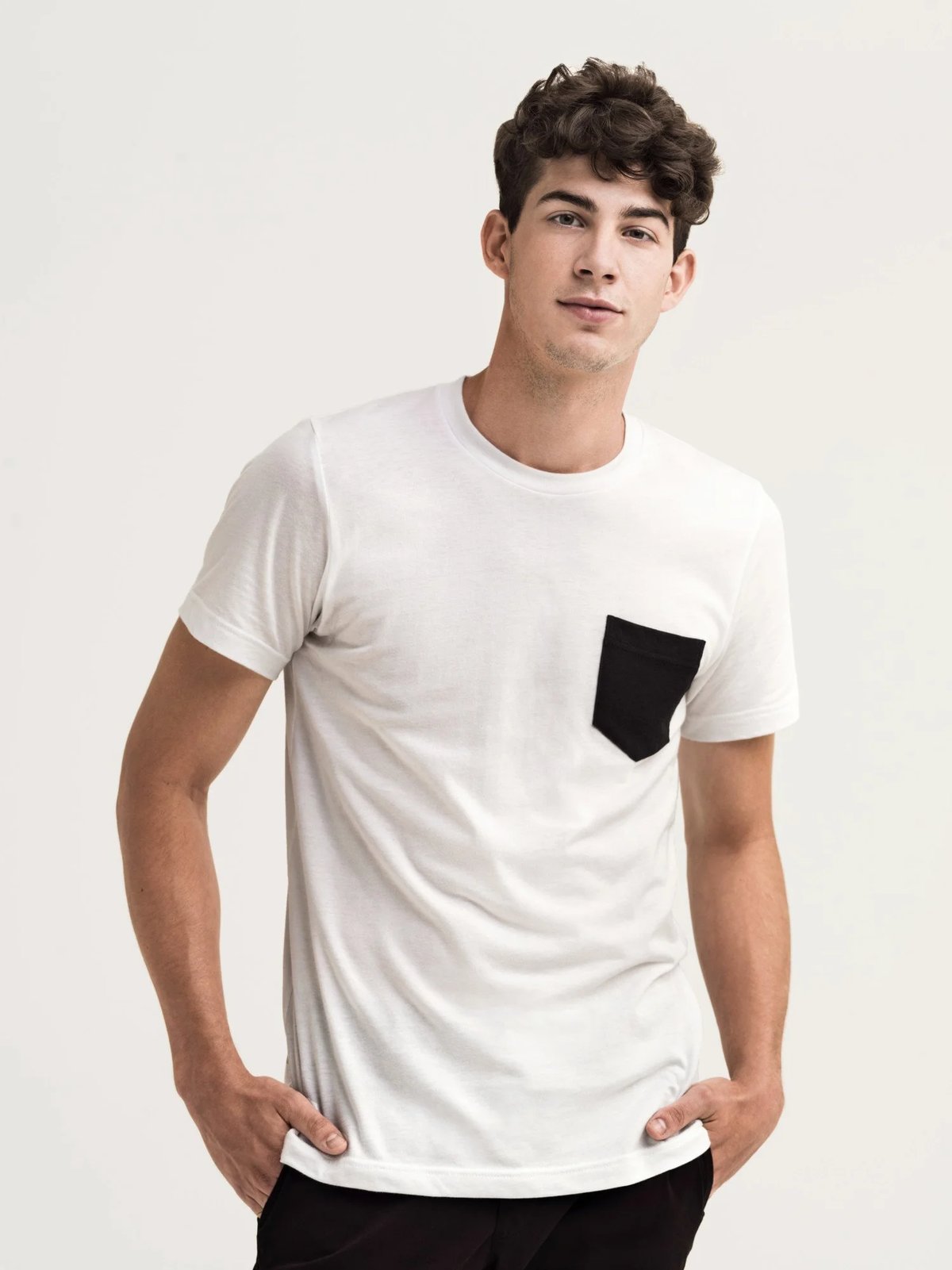 White sports club shirt black pocket uniform for Equinox by Finery.