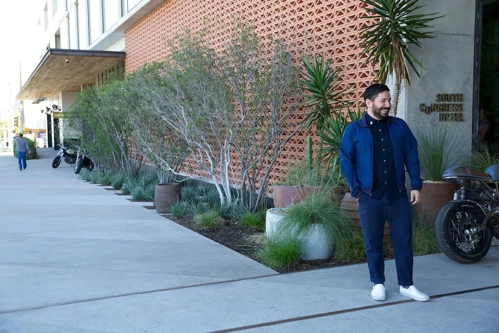 Bellhop wearing bespoke Uniforms for South Congress Hotel by Finery.