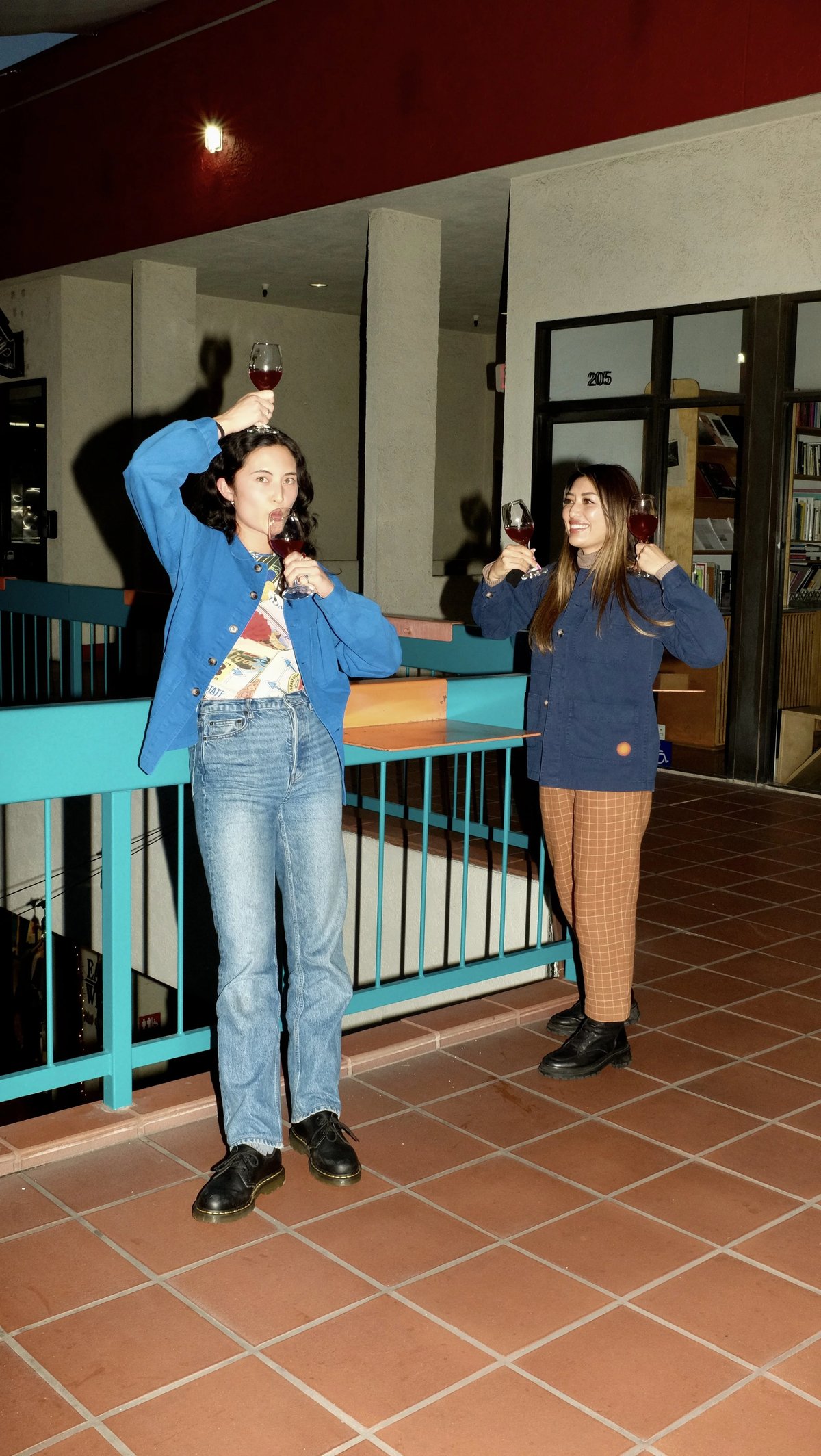 Two woman wearing custom workwear Lasita jacket uniforms designed by Finery.
