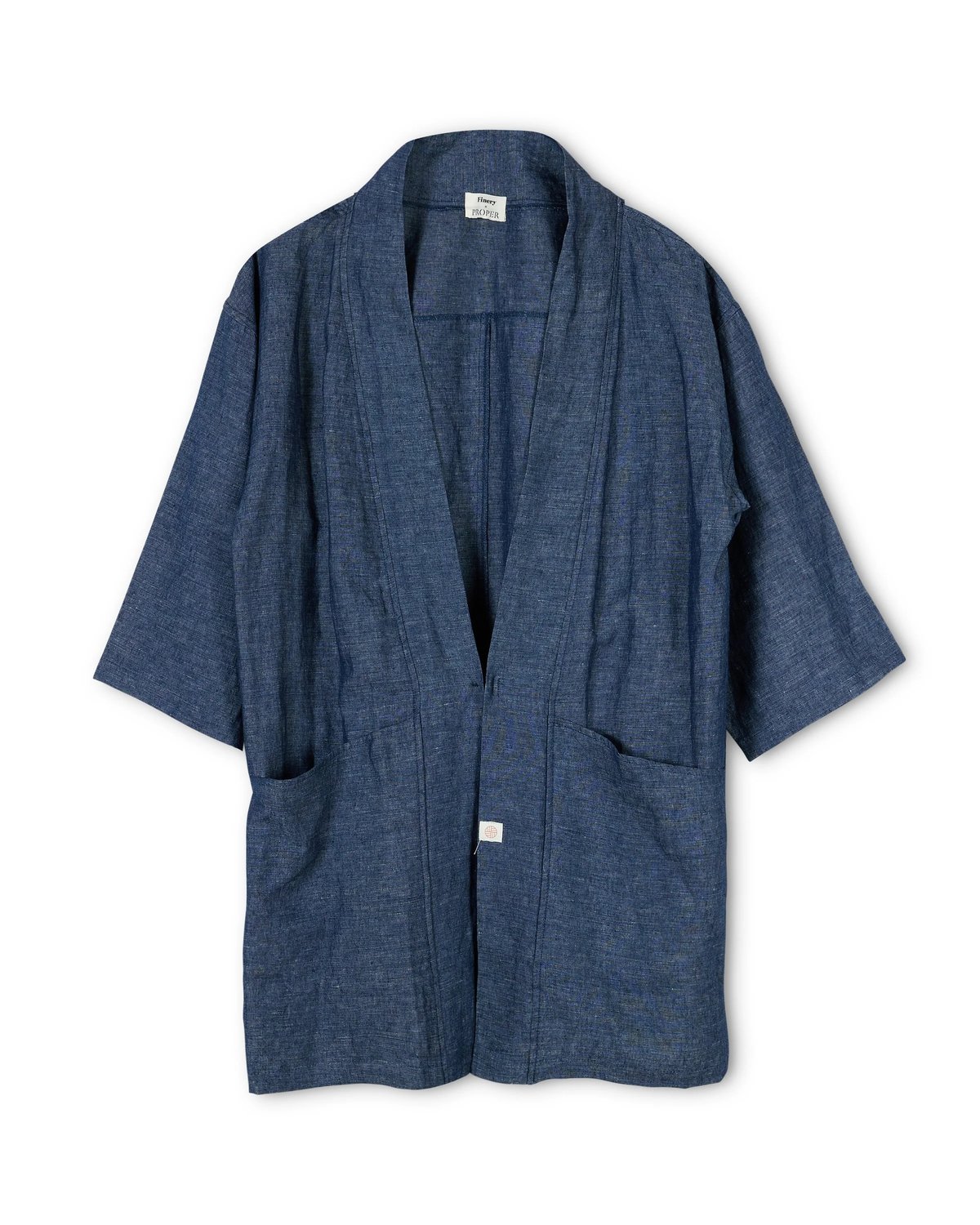 Flat lay of the Proper Hotels kimono coat in indigo designed by Finery.