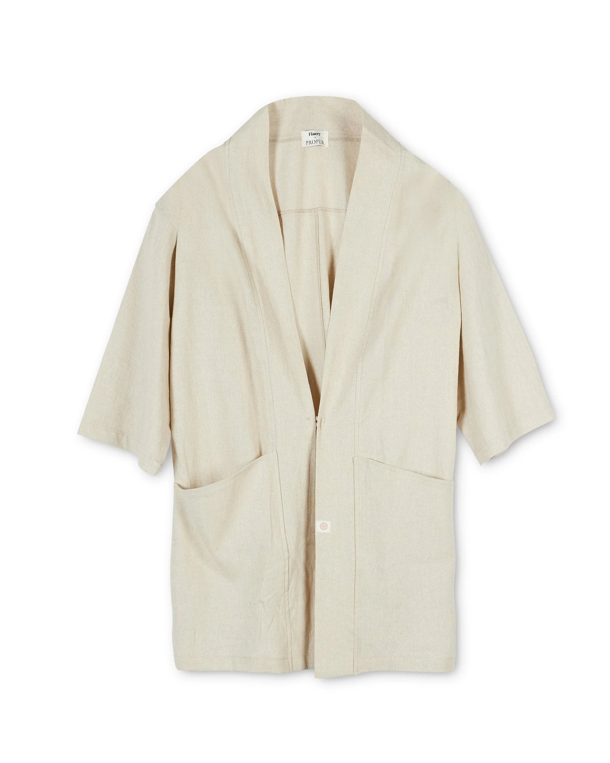 Flat lay of the Proper Hotels kimono coat in oatmeal designed by Finery.
