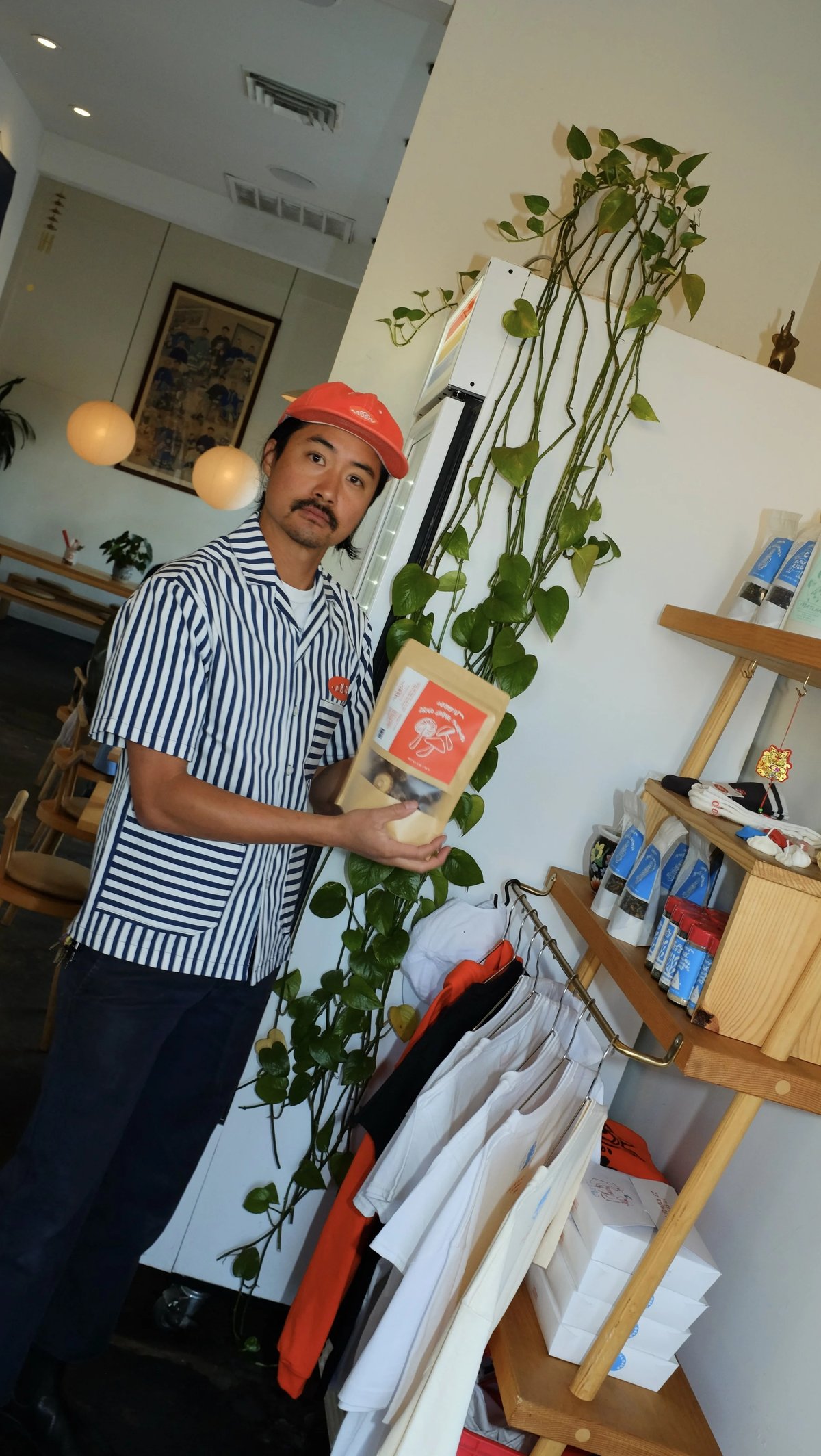Man wearing custom Woon work shirt uniform designed by Finery.