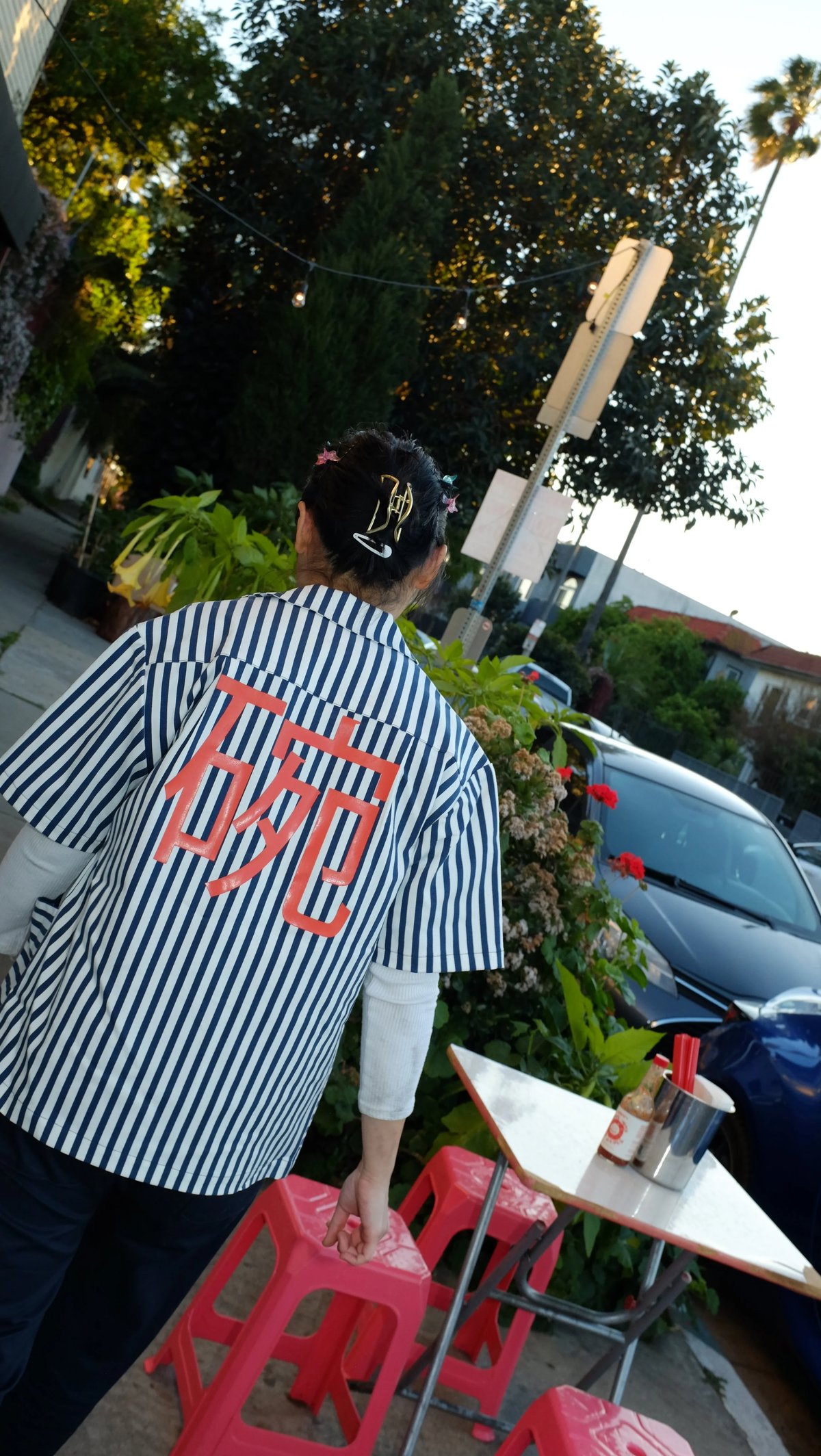The back of the custom Woon work shirt uniform designed by Finery.