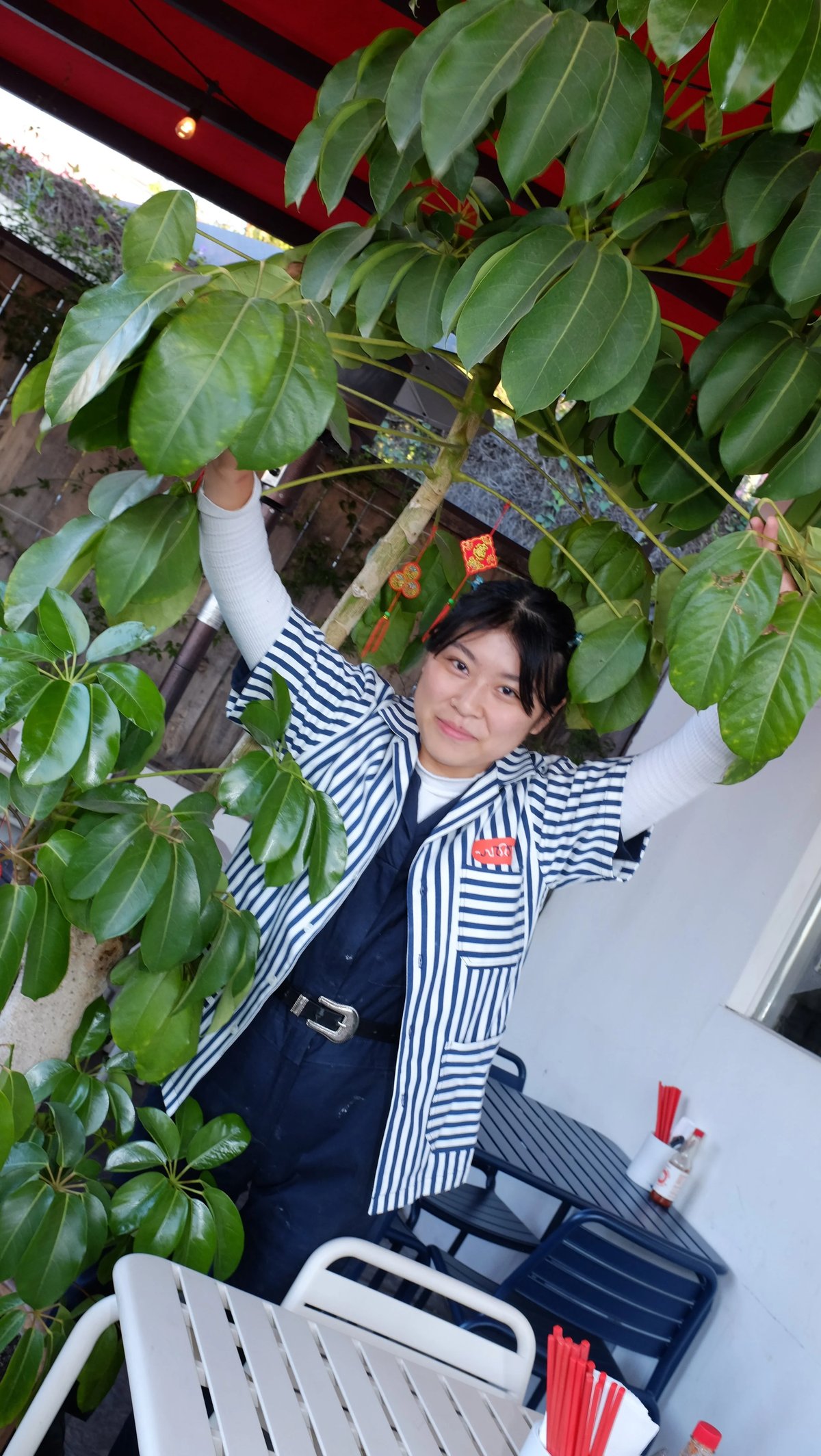 Worker wearing custom Woon work shirt uniform designed by Finery.