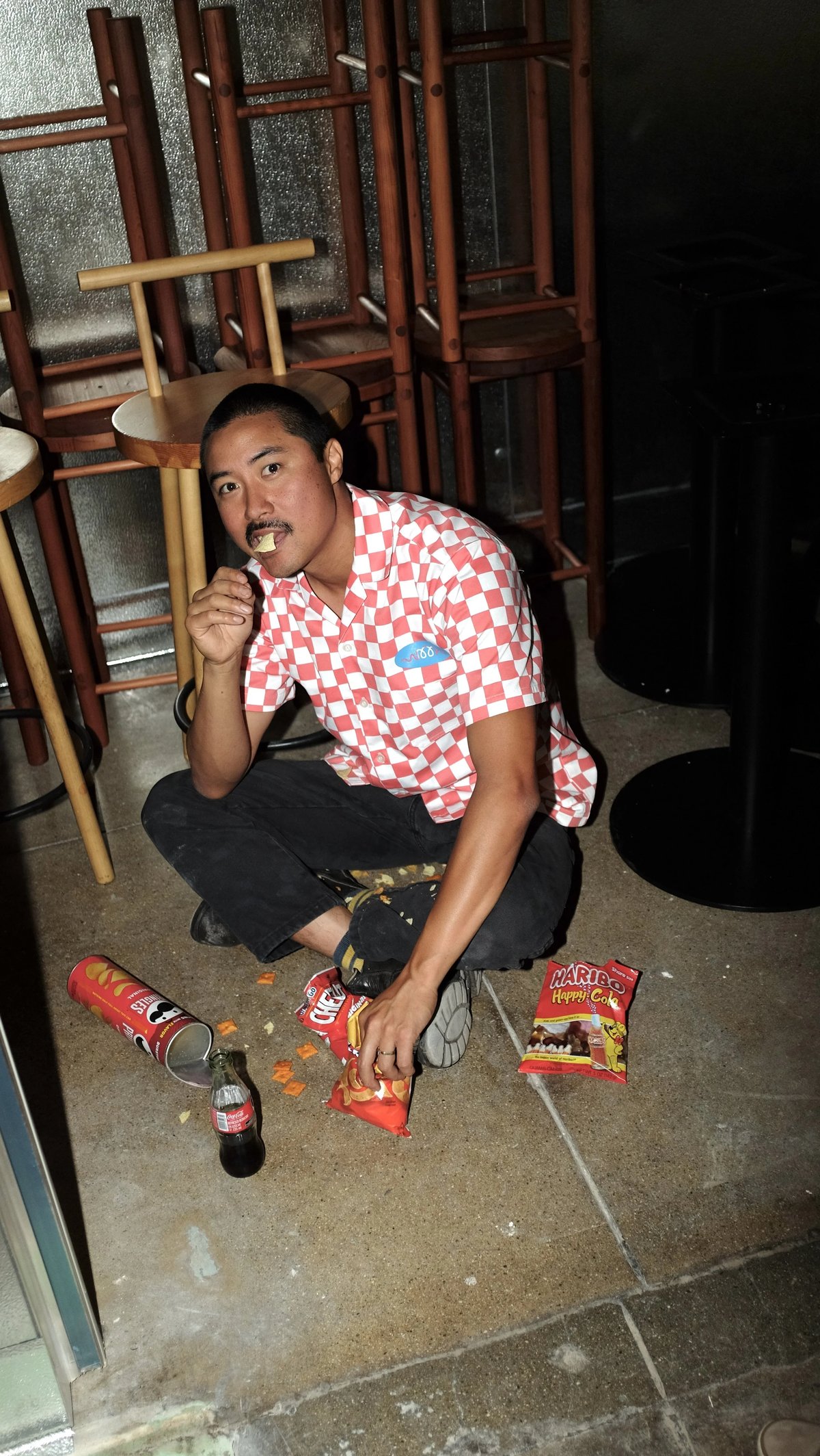 Man eating wearing Woon work shirt collaboration designed by Finery.